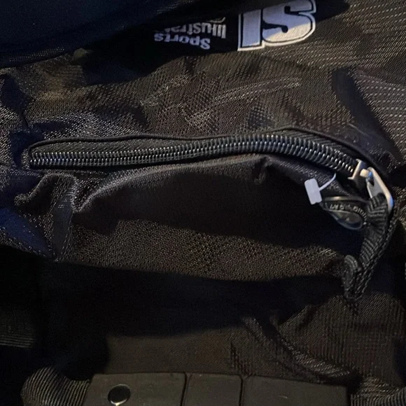 New OGIO sports illustrated black and gray duffle bag with shoulder strap.